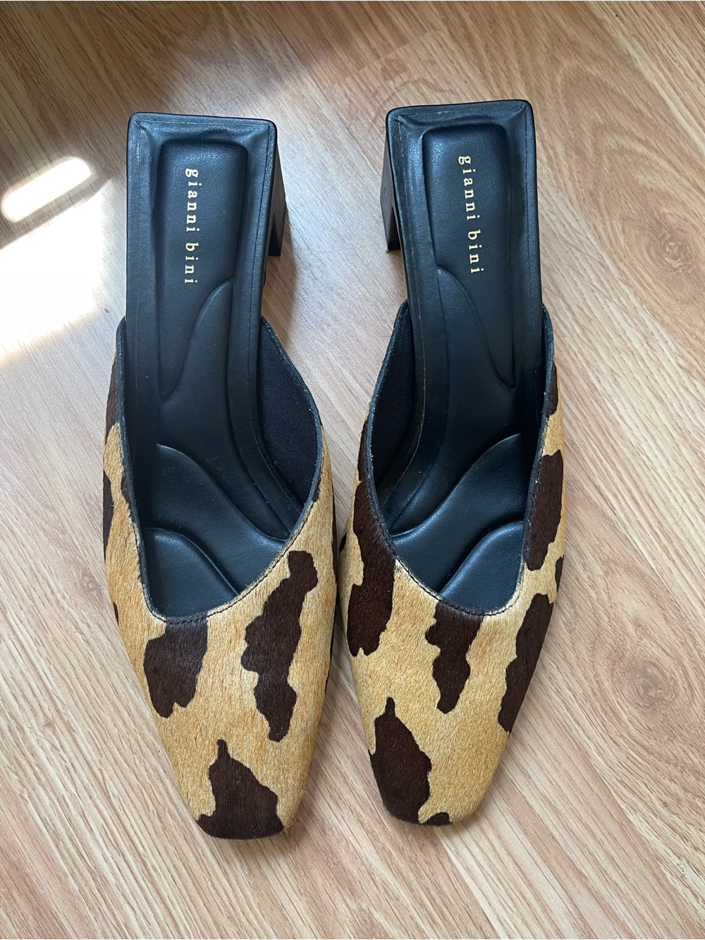 Gianni Bini Cow-Print Block Heel Mules in Brown and Tan